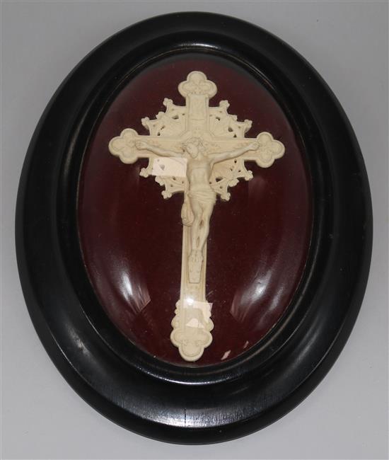 A crucifix under a glass case